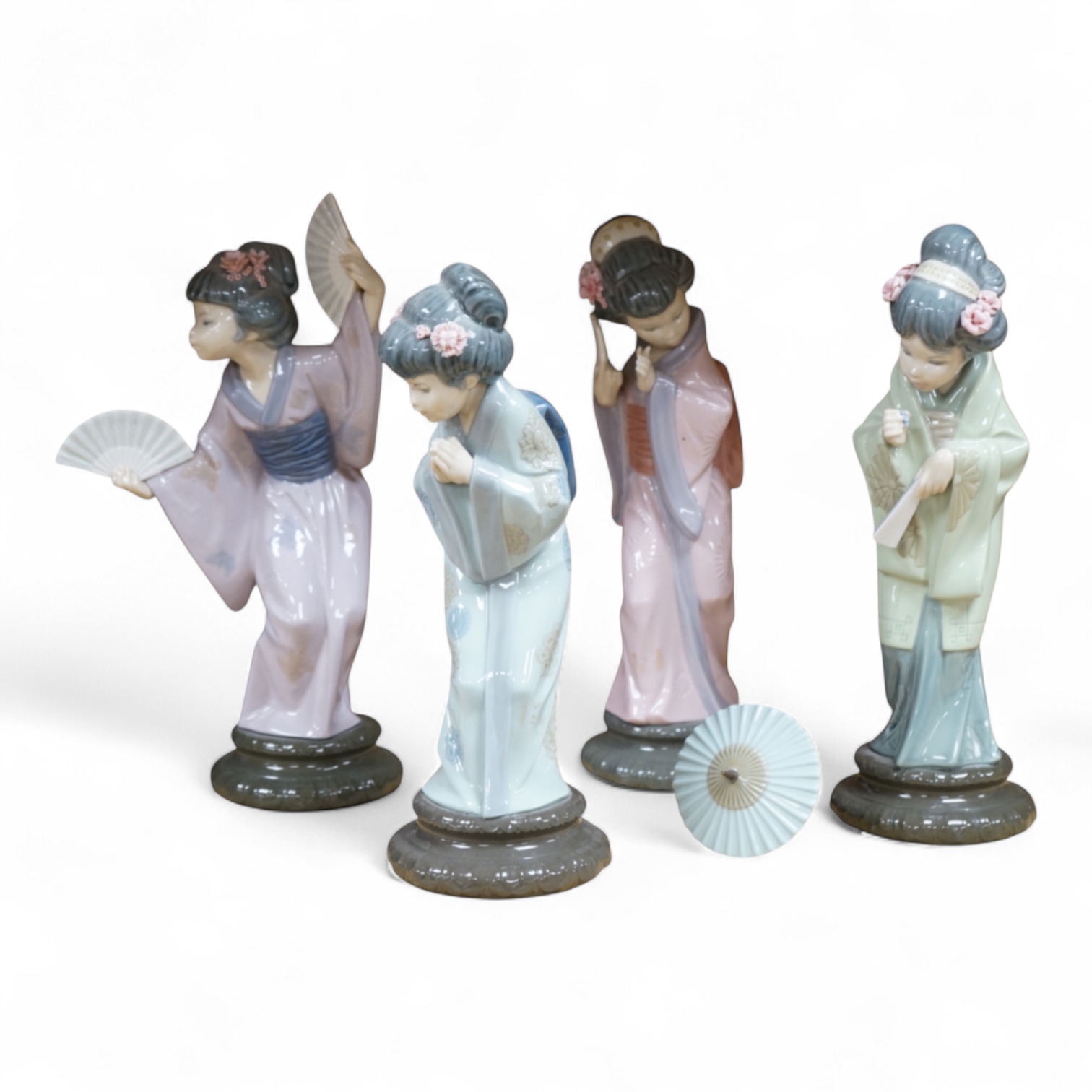 Four Lladro models of Geishas, tallest 30cm